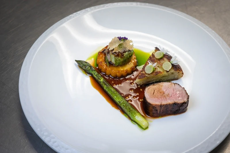 Fraser Hobday’s winning main course: BBQ pork fillet with faggot, rosti, asparagus and apple